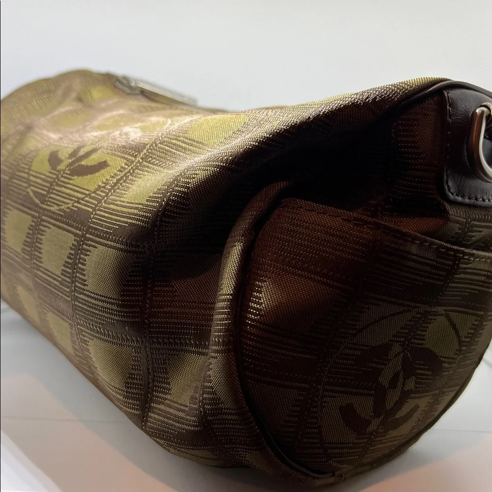 Chanel New Travel Line Mini Roll or Barrel Bag in a khaki or olive green color